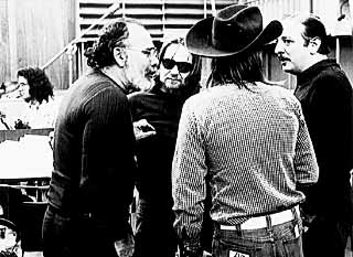 Wexler confers with  Willie Nelson (sunglasses)  and Arif Mardin (r).